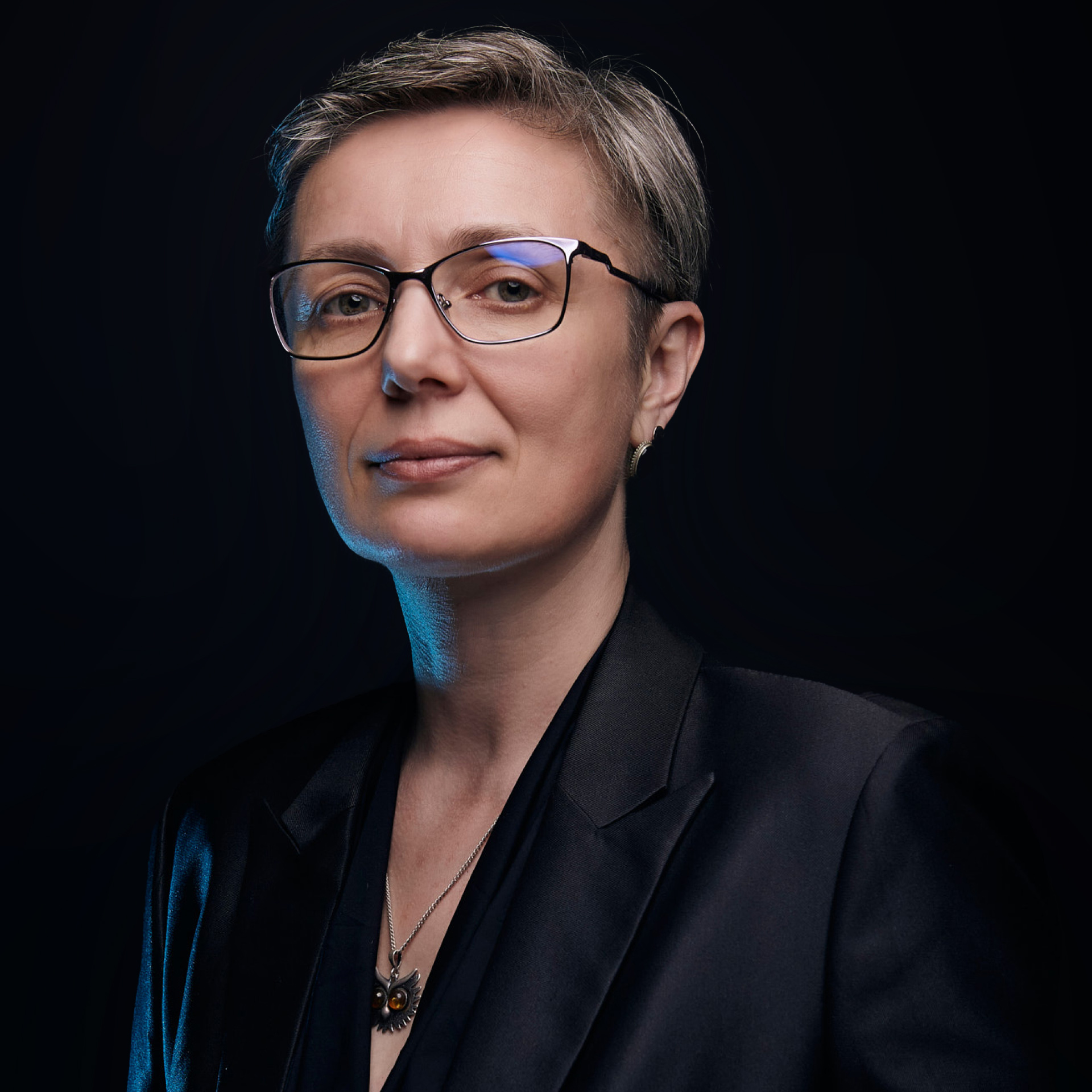 Elegant female business portrait with natural expression in studio